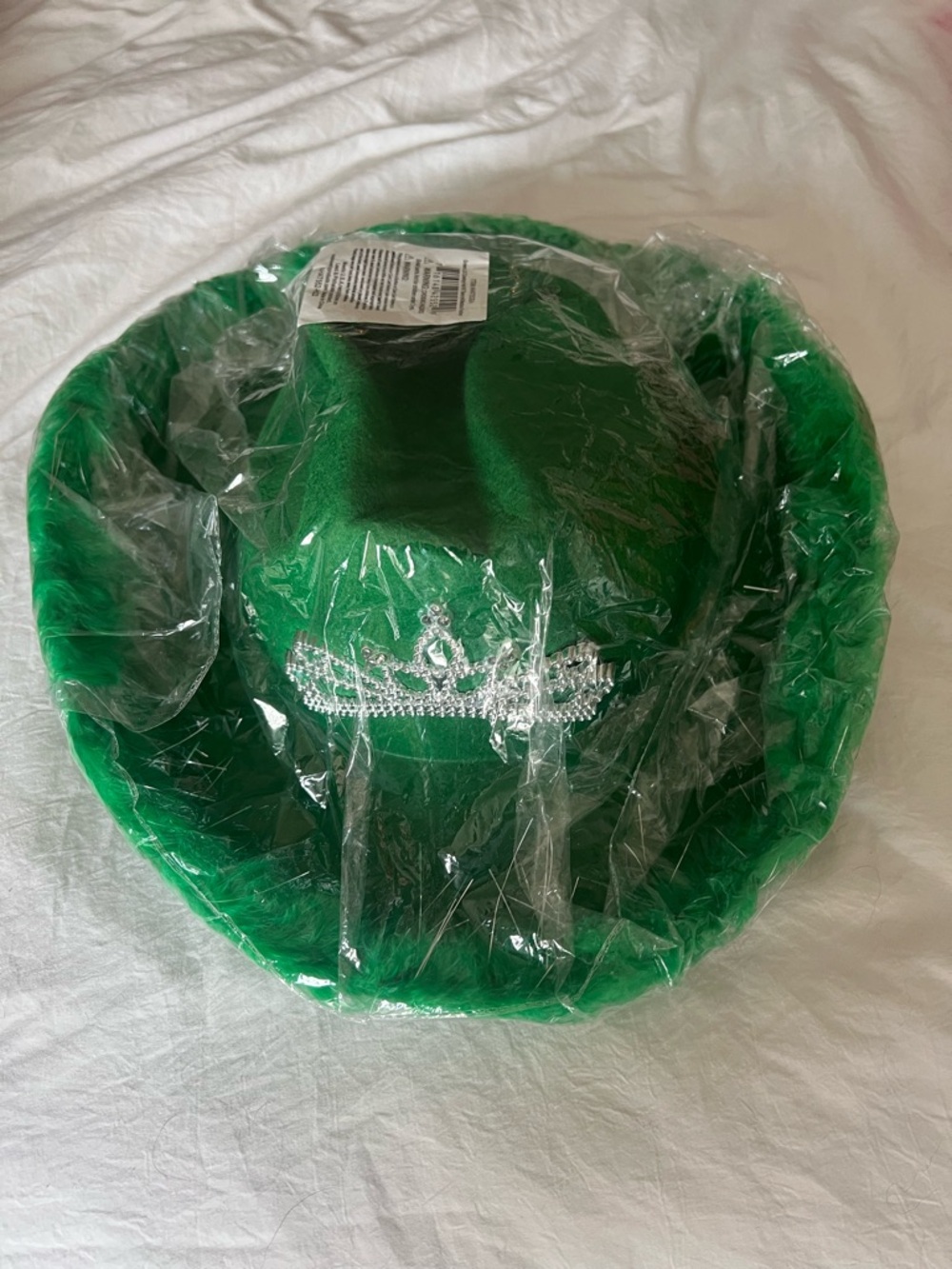 green cowboy hat with feathers and crown